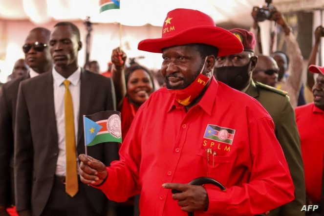 Salva Kiir (R), the President of South Sudan and the chair person of the Sudan People's Liberation Movement (SPLM), attends the meeting of the National Liberation Council at the Freedom Hall in Juba on December 2, 2022. (Photo by Samir BOL / AFP)