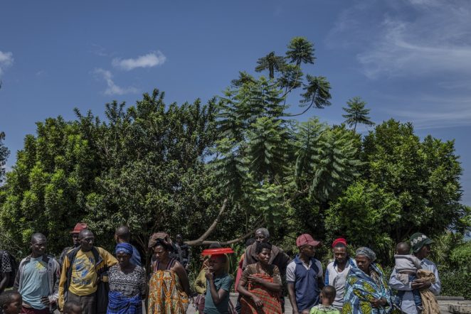 Rwandan refugees who were living in eastern Congo since the 1994 Rwanda genocide wait for repatriation from Goma, Democratic Republic of the Congo, on Saturday, May 17, 2025. (AP Photo/Moses Sawasawa)