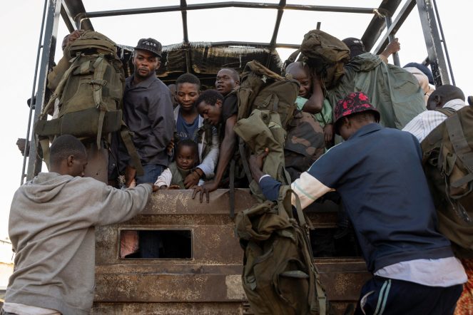 Captured members of the armed forces of the Democratic Republic of the Congo (FARDC) and Wazalendo troops board trucks for training by M23 rebels, in Goma, North Kivu, Democratic Republic of Congo, May 10, 2025. REUTERS/Arlette Bashizi